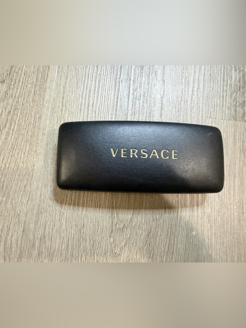 Versace Black Case with Gold Lettering